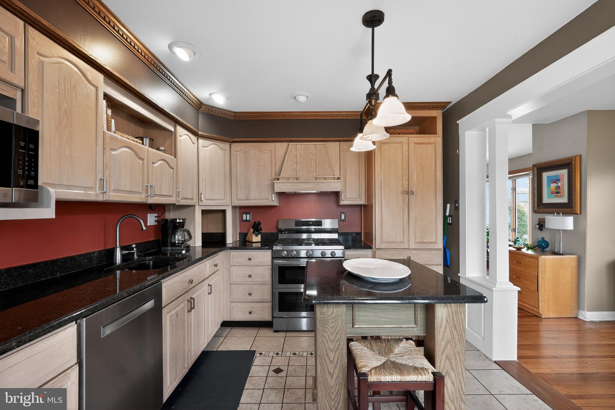 1001 Rydal Road Cherry Hill, NJ 08034 - Photo 12 of 47 a kitchen with stainless steel appliances granite countertop a stove sink and cabinets