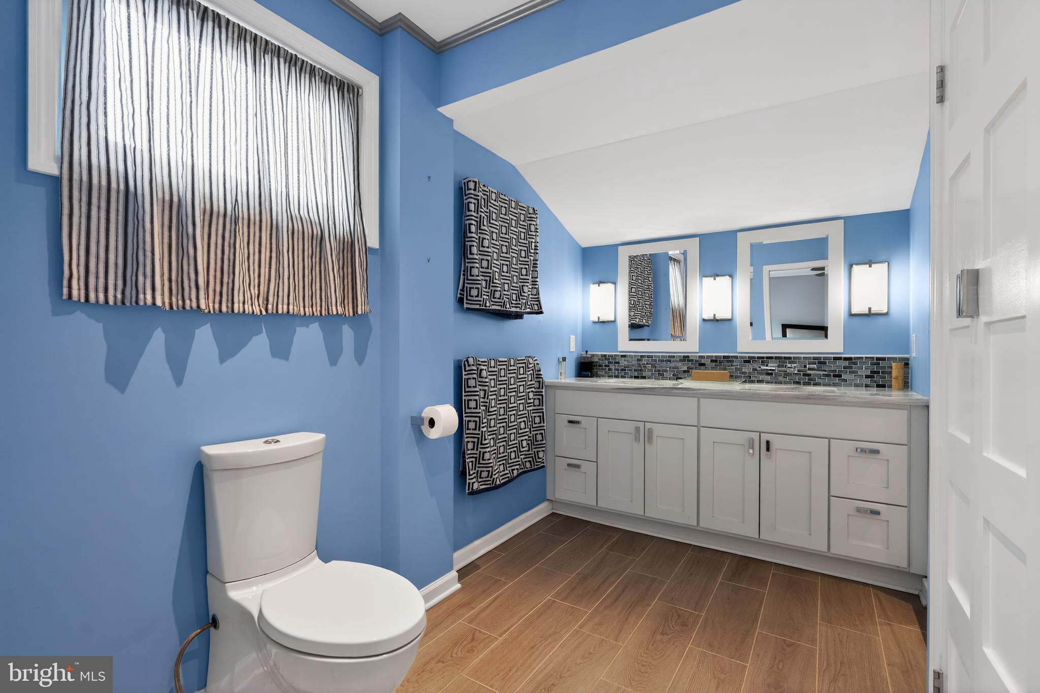 1001 Rydal Road Cherry Hill, NJ 08034 - Photo 26 of 47 a bathroom with a granite countertop toilet sink and mirror