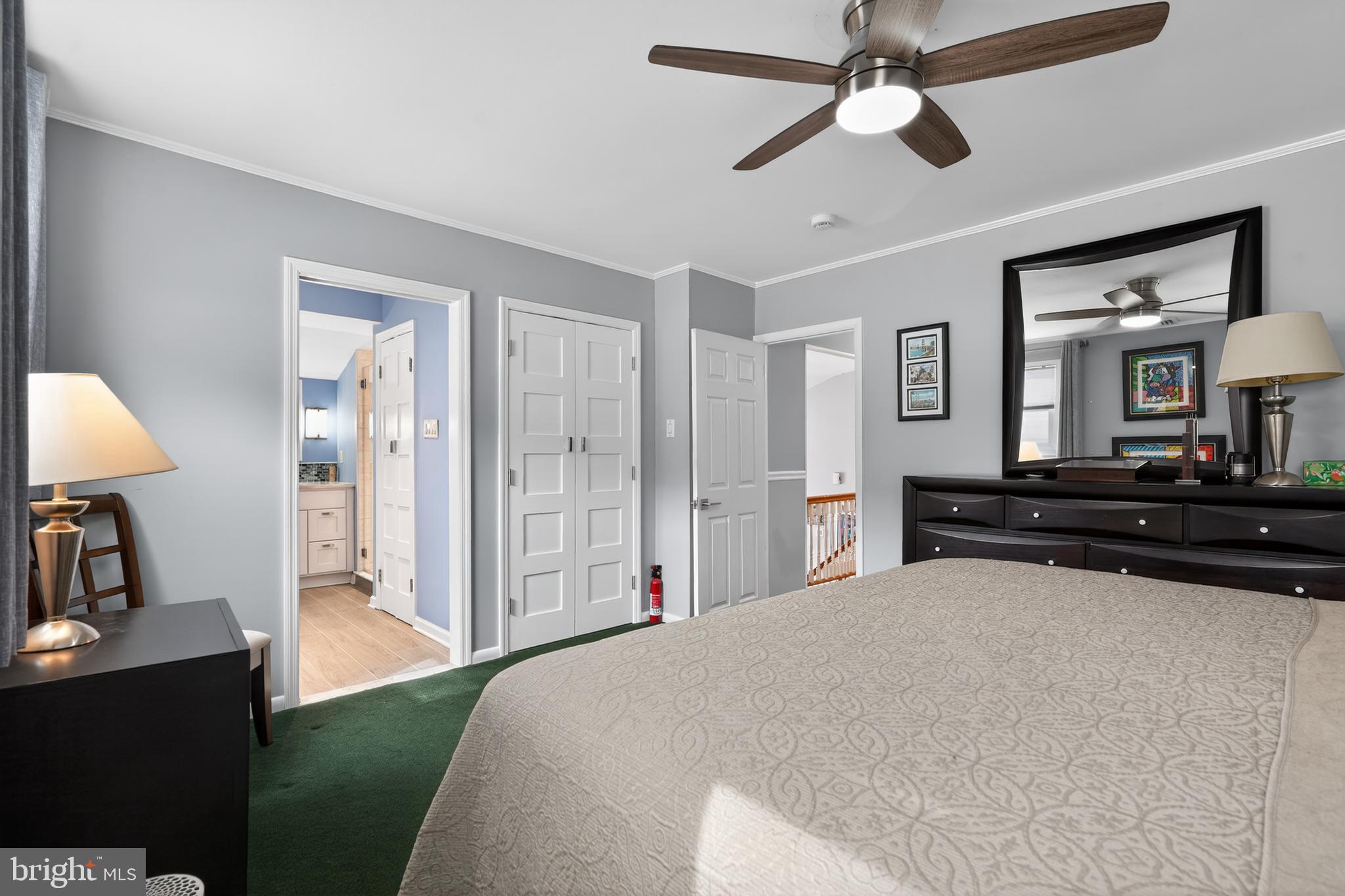 1001 Rydal Road Cherry Hill, NJ 08034 - Photo 29 of 47 a large bedroom with a bed and a chandelier