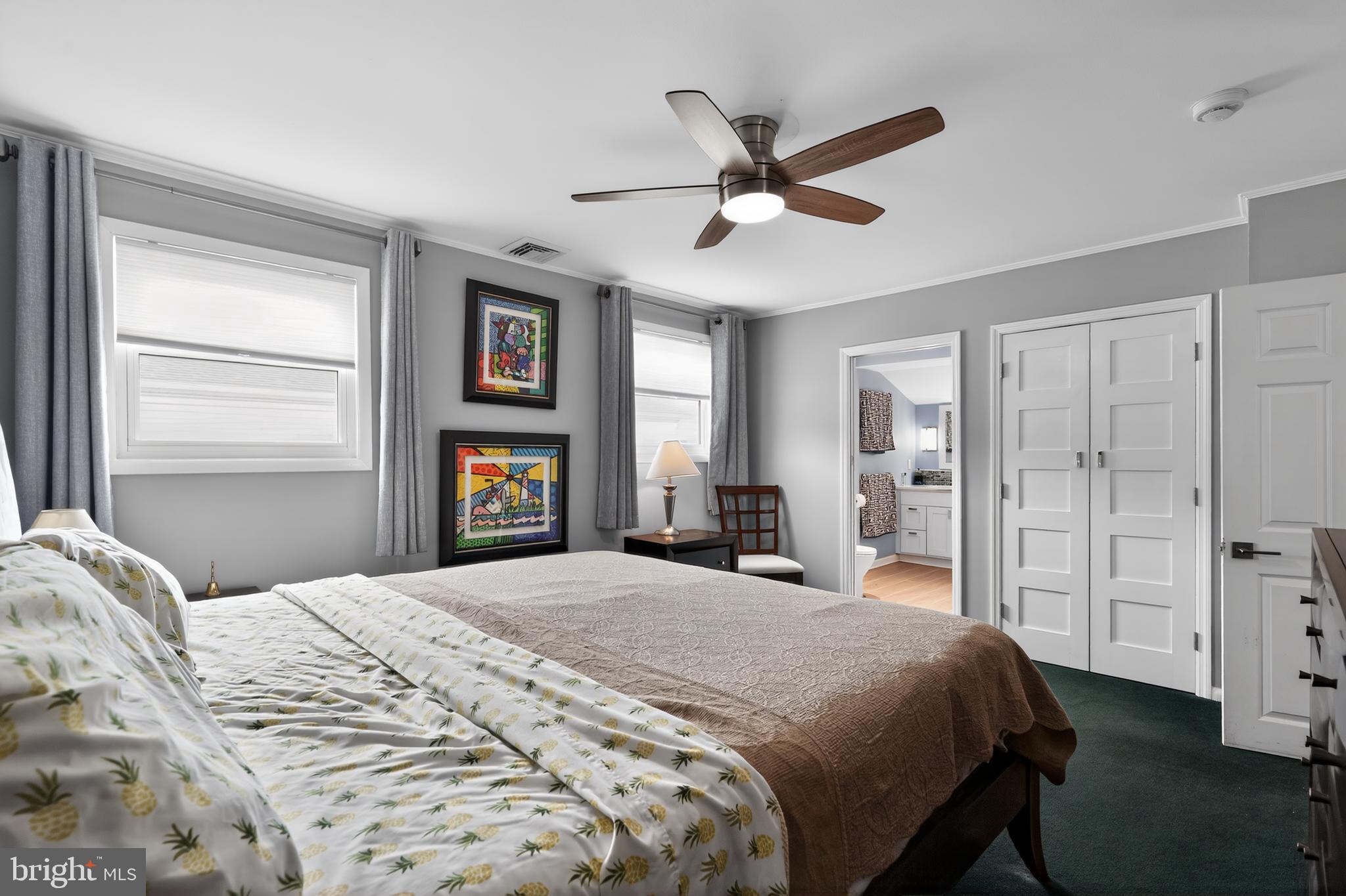 1001 Rydal Road Cherry Hill, NJ 08034 - Photo 30 of 47 a bedroom with a large bed and a chandelier