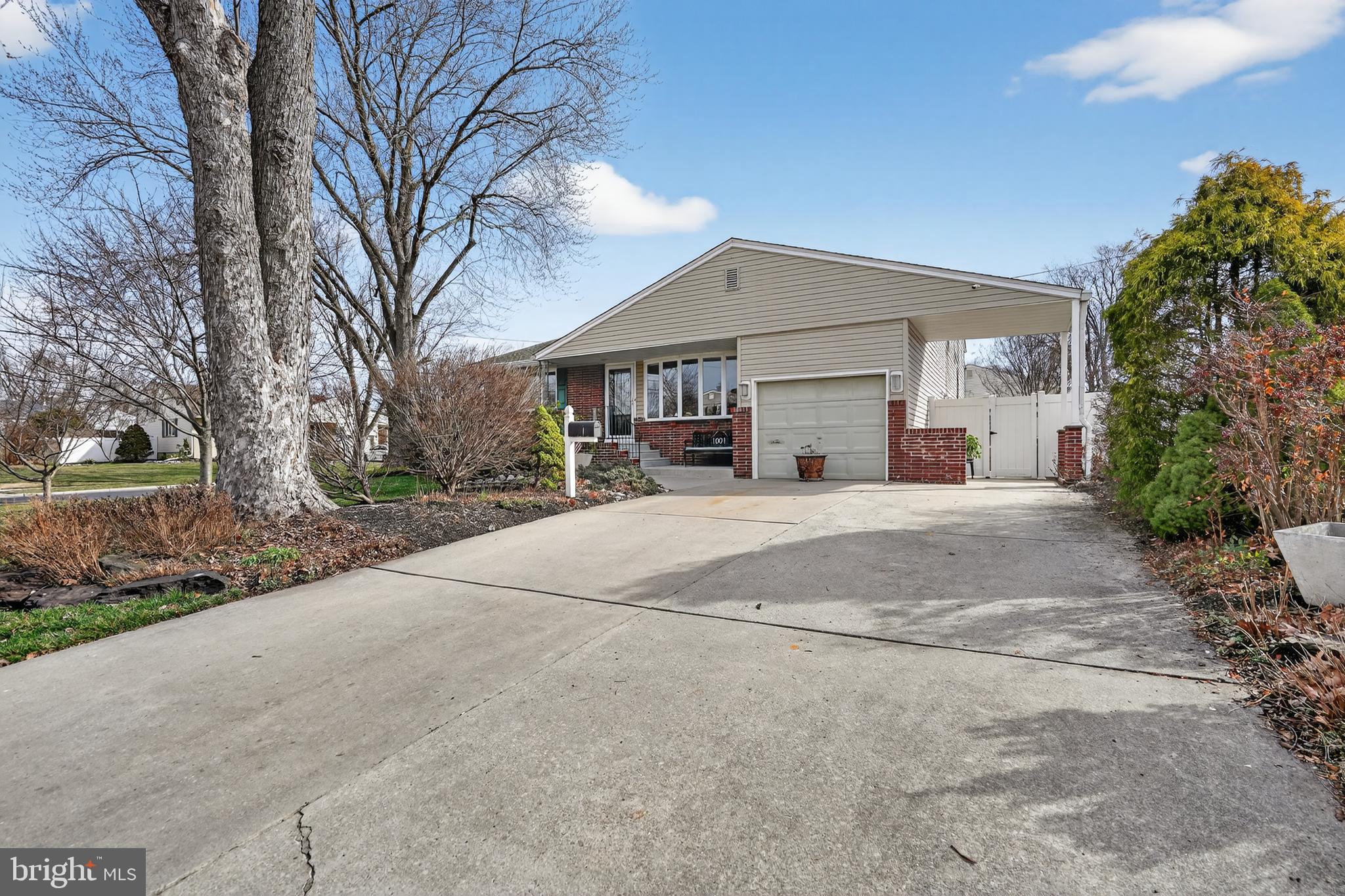 1001 Rydal Road Cherry Hill, NJ 08034 - Photo 3 of 47 a view of a house with a yard and large tree