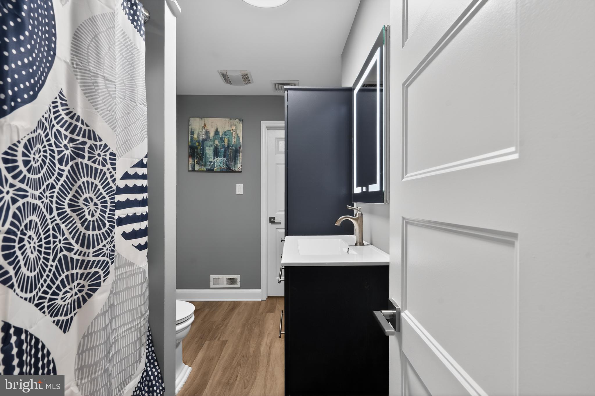 1001 Rydal Road Cherry Hill, NJ 08034 - Photo 31 of 47 a bathroom with a sink and mirror with toilet