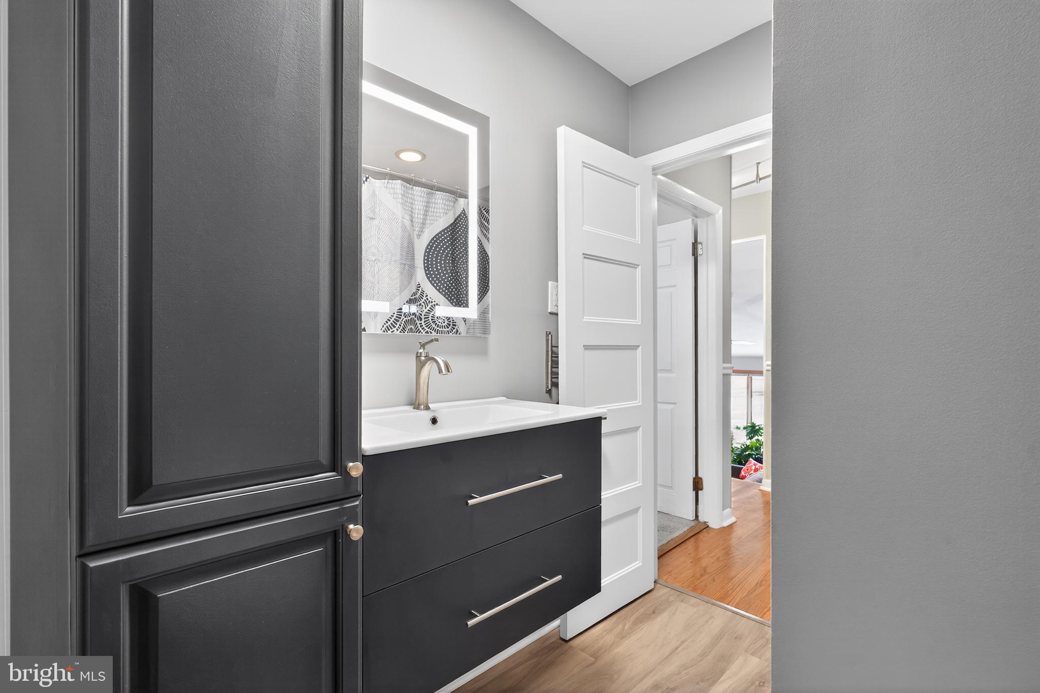 1001 Rydal Road Cherry Hill, NJ 08034 - Photo 32 of 47 a bathroom with a sink vanity granite and a mirror