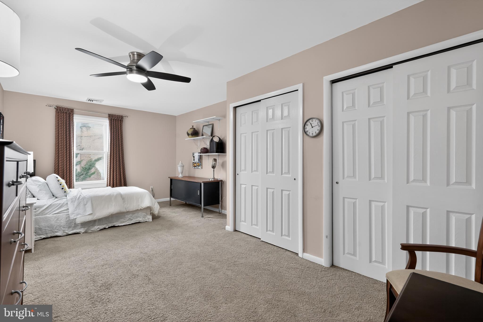1001 Rydal Road Cherry Hill, NJ 08034 - Photo 33 of 47 a spacious bedroom with a bed closet and a window