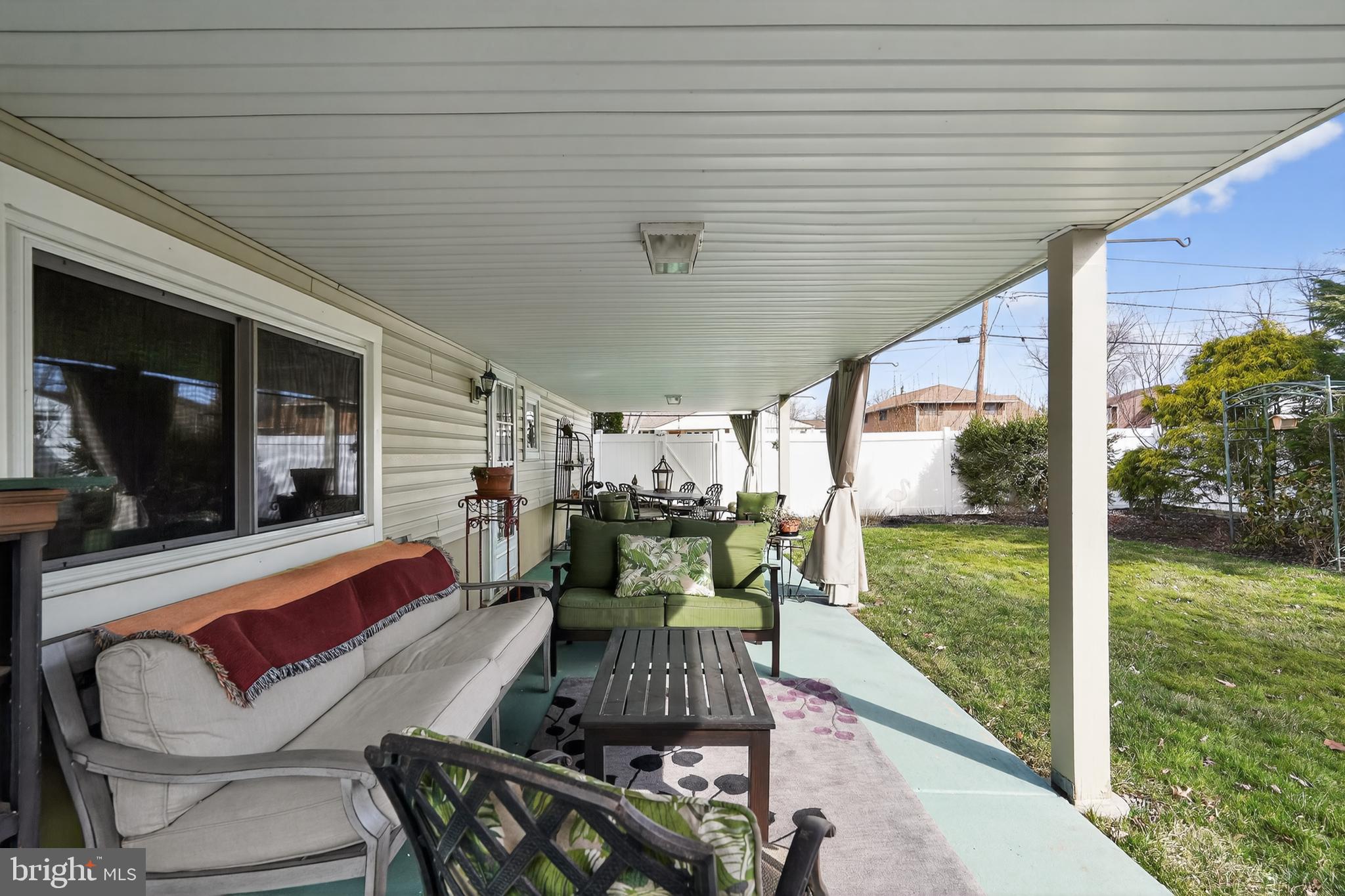 1001 Rydal Road Cherry Hill, NJ 08034 - Photo 40 of 47 a view of a patio with table and chairs potted plants with floor to ceiling window and potted plants