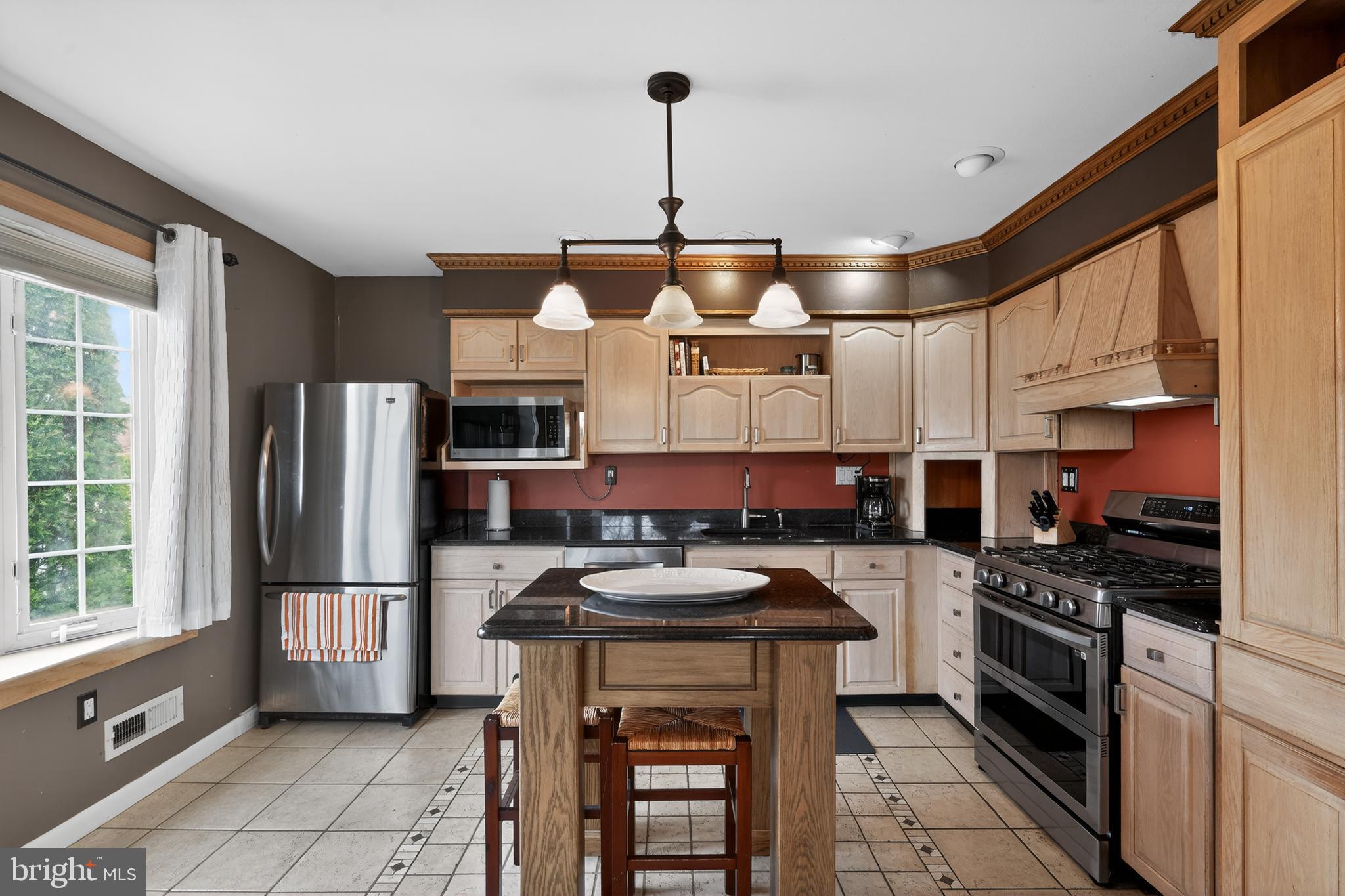 1001 Rydal Road Cherry Hill, NJ 08034 - Photo 10 of 47 a kitchen with stainless steel appliances granite countertop a stove refrigerator sink and cabinets