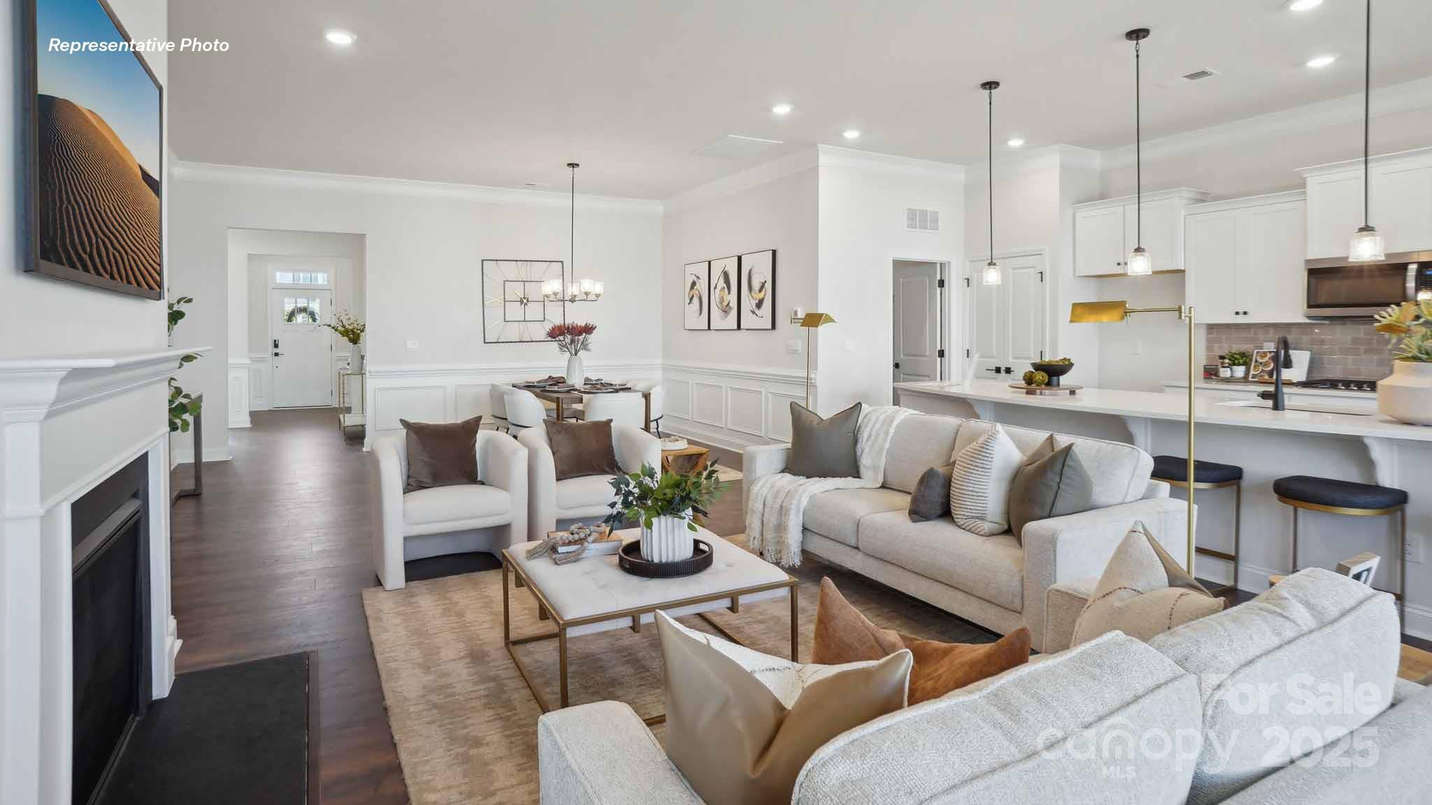 3128 Spring Iris Drive Denver, NC 28037 - Photo 12 of 24 a living room with fireplace furniture and a flat screen tv
