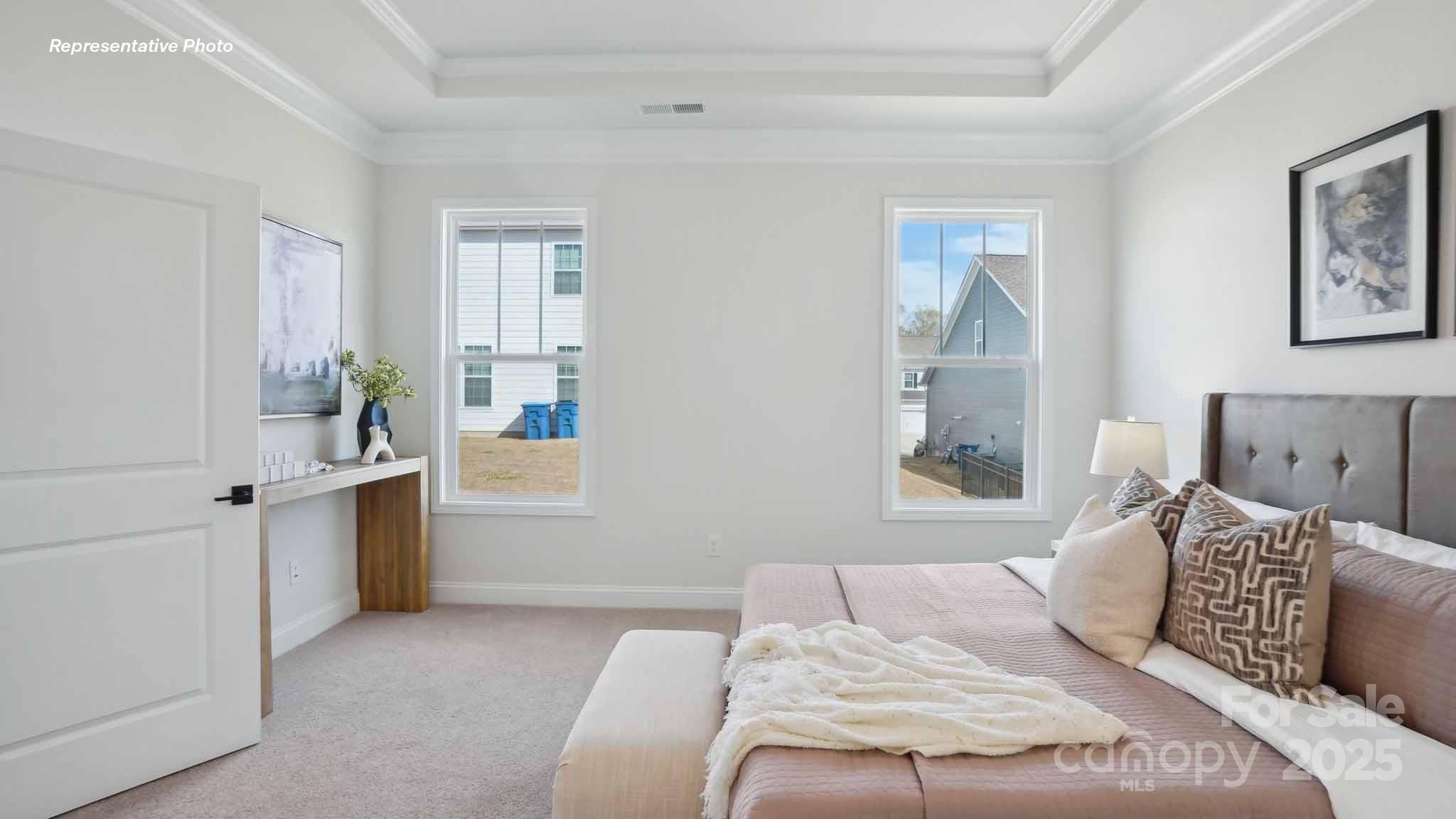 3128 Spring Iris Drive Denver, NC 28037 - Photo 14 of 24 a bedroom with a large bed and a window