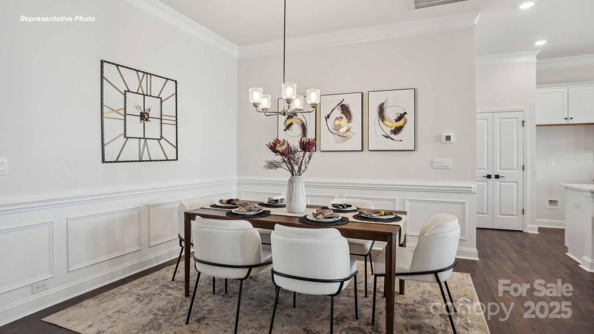 3128 Spring Iris Drive Denver, NC 28037 - Photo 9 of 24 a view of a dining room with furniture and wooden floor