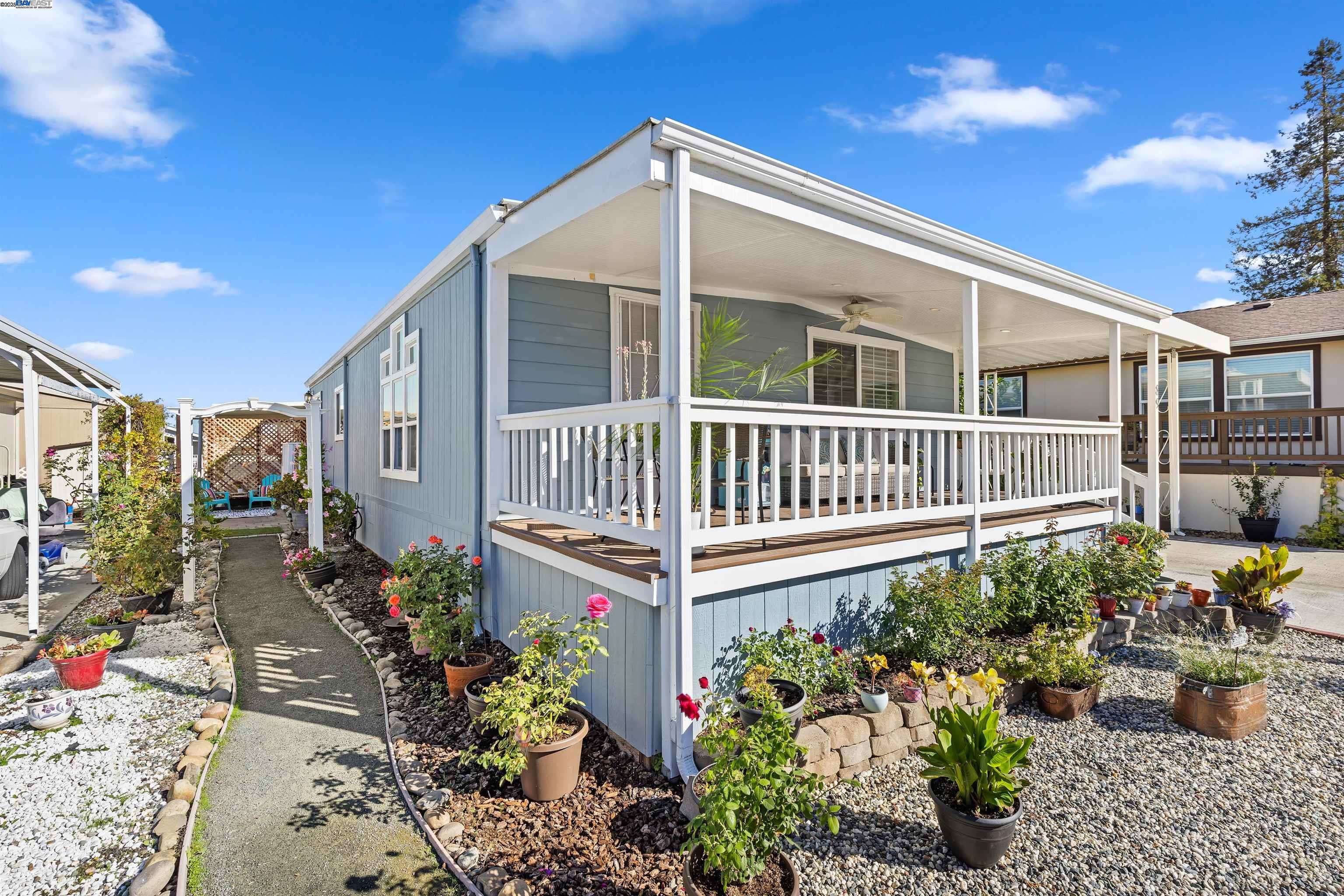 3263 Vineyard Avenue, Unit 89 Pleasanton, CA 94566 - Photo 3 of 41 a view of a chair and table in the patio