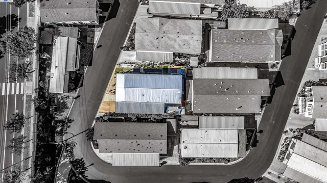 an aerial view of a building and yard