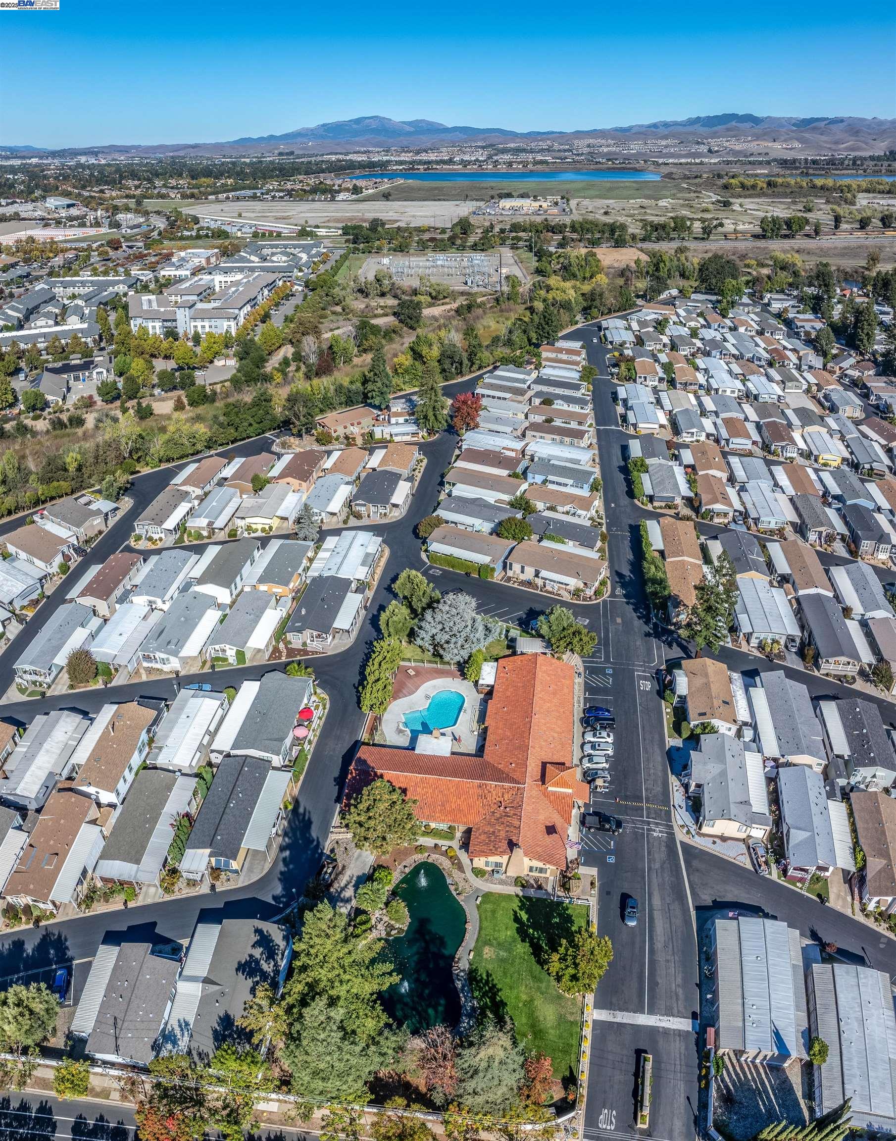 3263 Vineyard Avenue, Unit 89 Pleasanton, CA 94566 - Photo 34 of 41 an aerial view of residential building and lake view