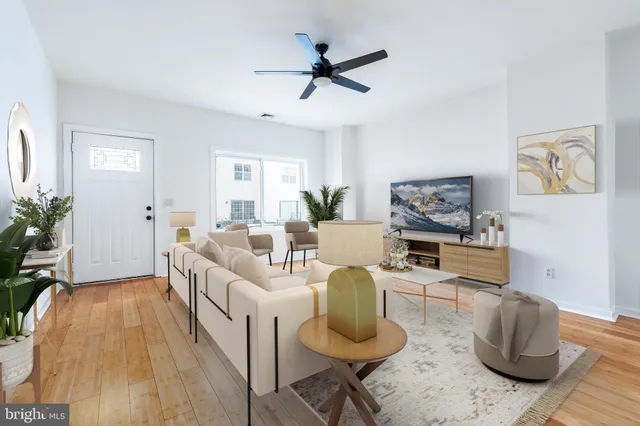 a living room with furniture and a table