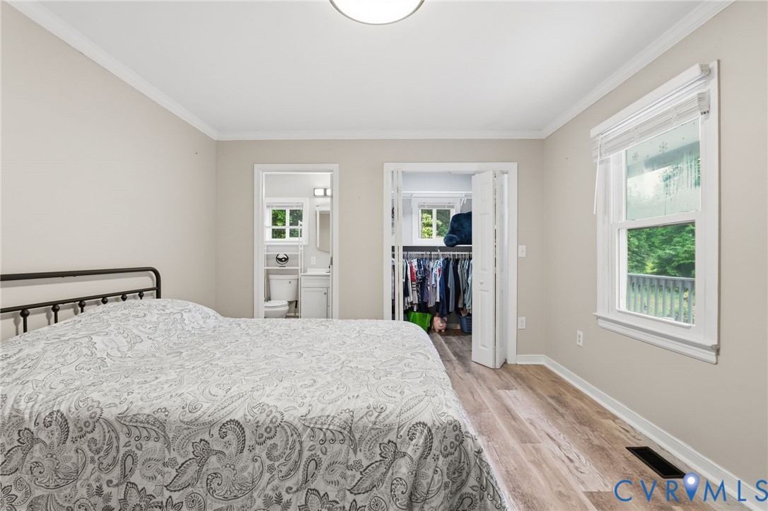 9110 Gayton Road Henrico, VA 23229 - Photo 17 of 54 a bedroom with a bed and a window