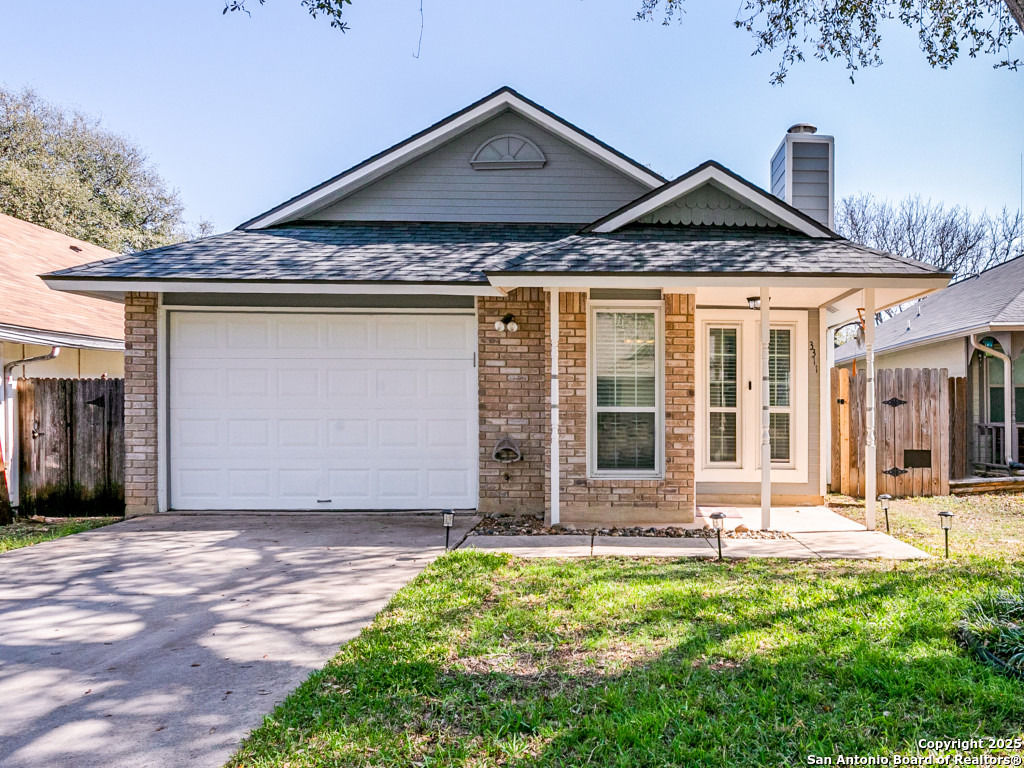 3311 Stone Cave San Antonio, TX 78247 - Photo 1 of 1 a front view of a house with a yard