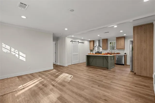 a view of kitchen with kitchen island view and wooden floor