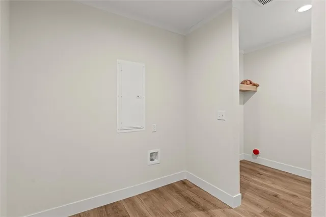 a view of a room with wooden floor