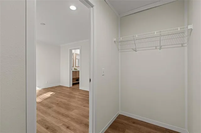 a view of hallway with wooden floor