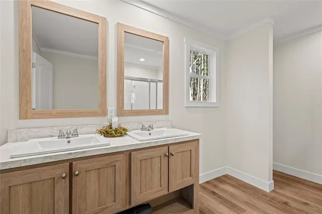 a bathroom with 2 sink and a mirror