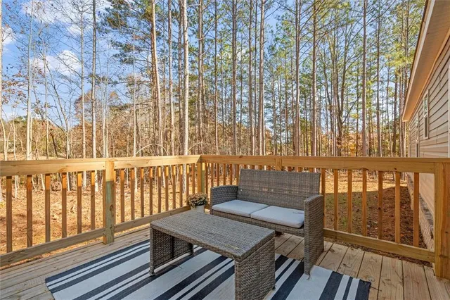 a view of a balcony with wooden floor