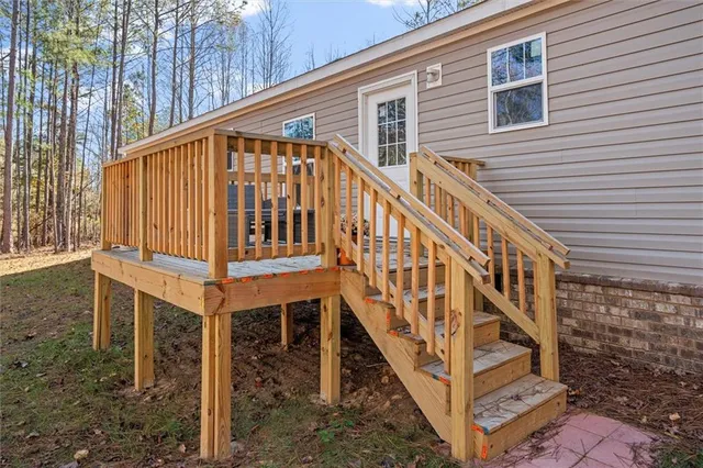 a front view of a house with wooden stairs