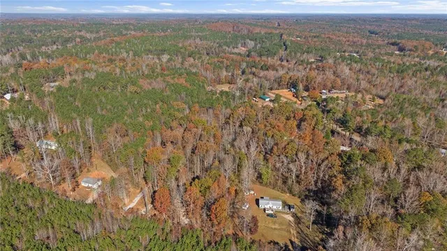 a view of a city with lush green forest