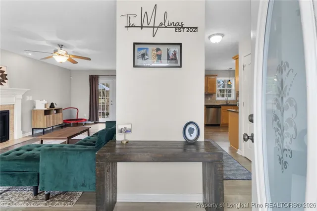 a living room with furniture and a fireplace