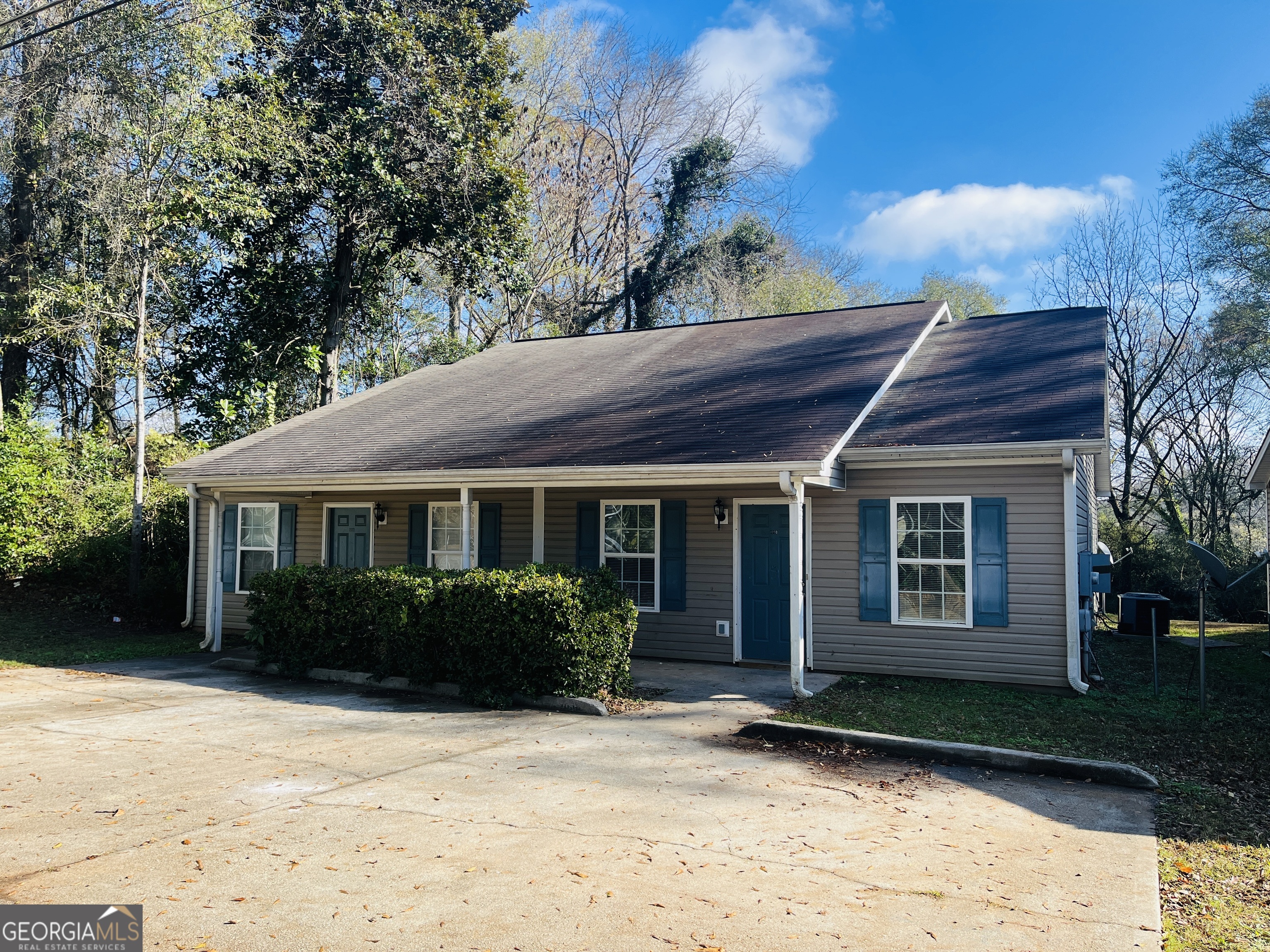 105 Granite Street, Unit B Hogansville, GA 30230 - Photo 1 of 28 a front view of a house with garden