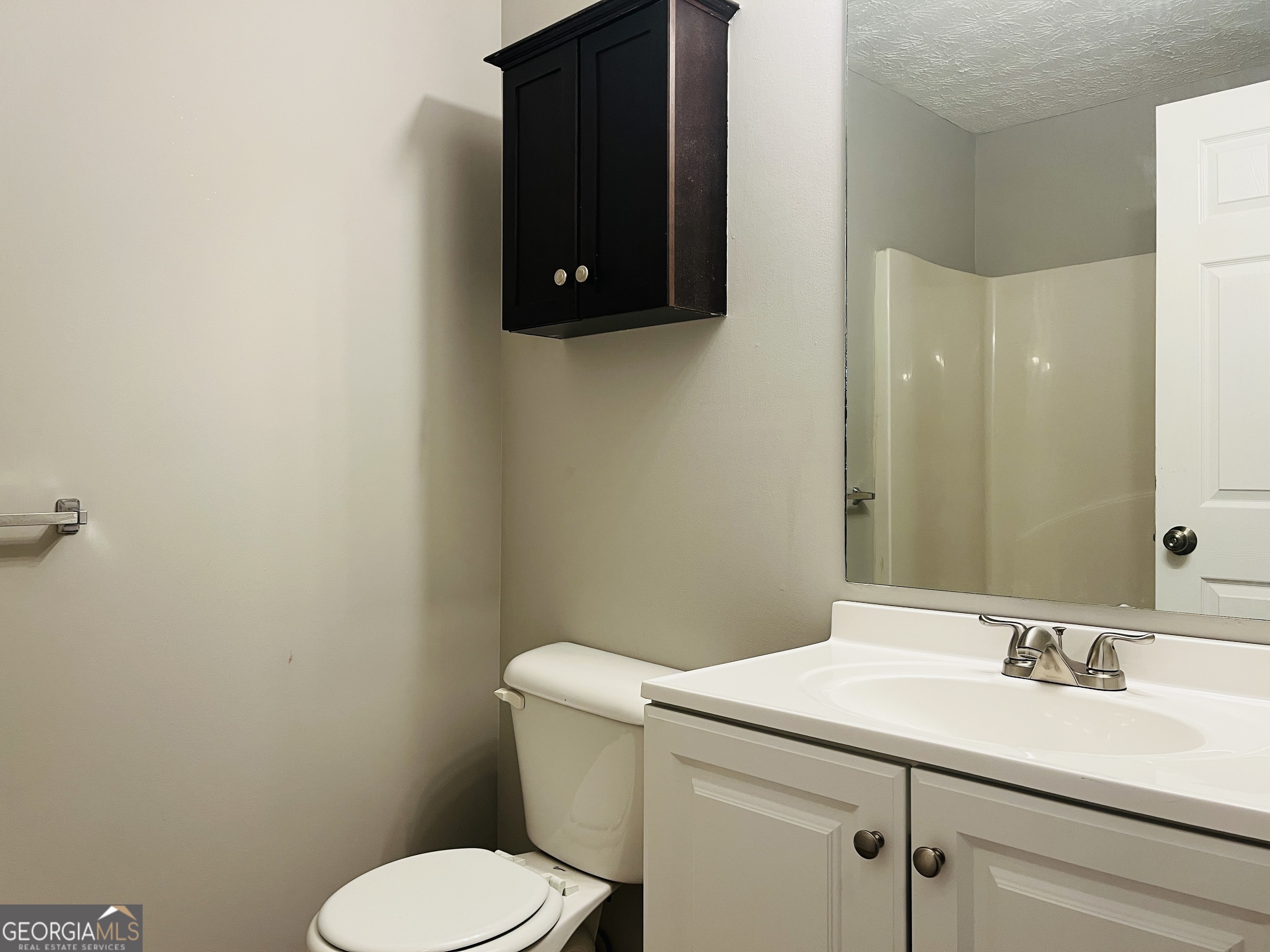 105 Granite Street, Unit B Hogansville, GA 30230 - Photo 13 of 28 a bathroom with a sink toilet and mirror