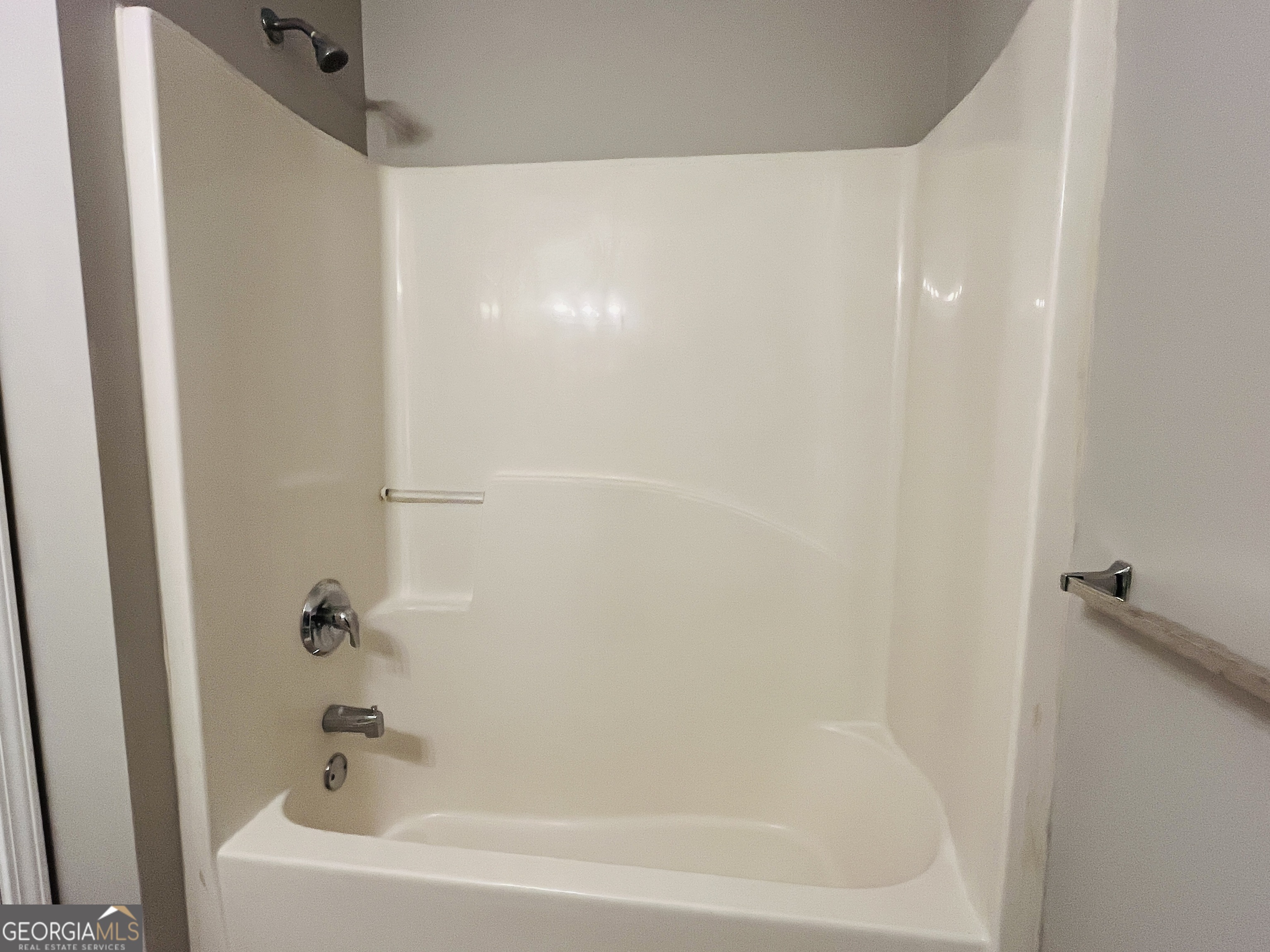 105 Granite Street, Unit B Hogansville, GA 30230 - Photo 14 of 28 a close up of a bathtub in a bathroom