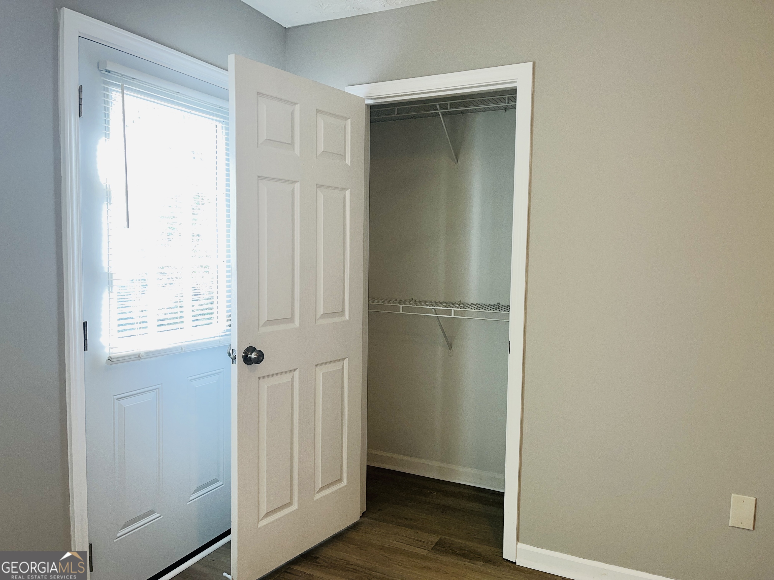 105 Granite Street, Unit B Hogansville, GA 30230 - Photo 21 of 28 a view of empty room with wooden floor