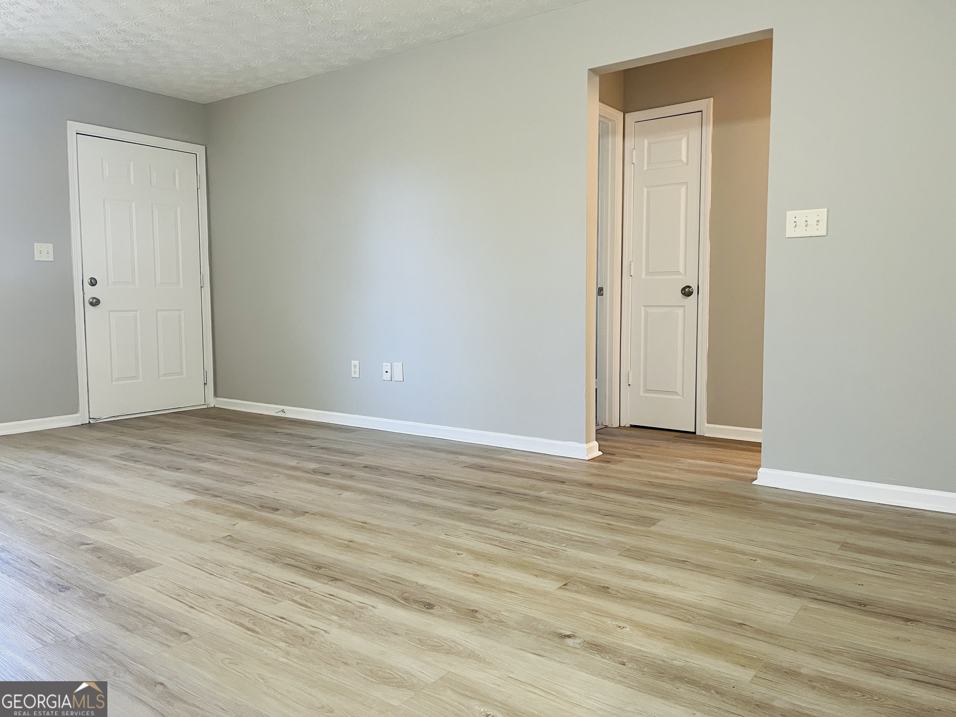 105 Granite Street, Unit B Hogansville, GA 30230 - Photo 5 of 28 a view of an empty room and wooden floor