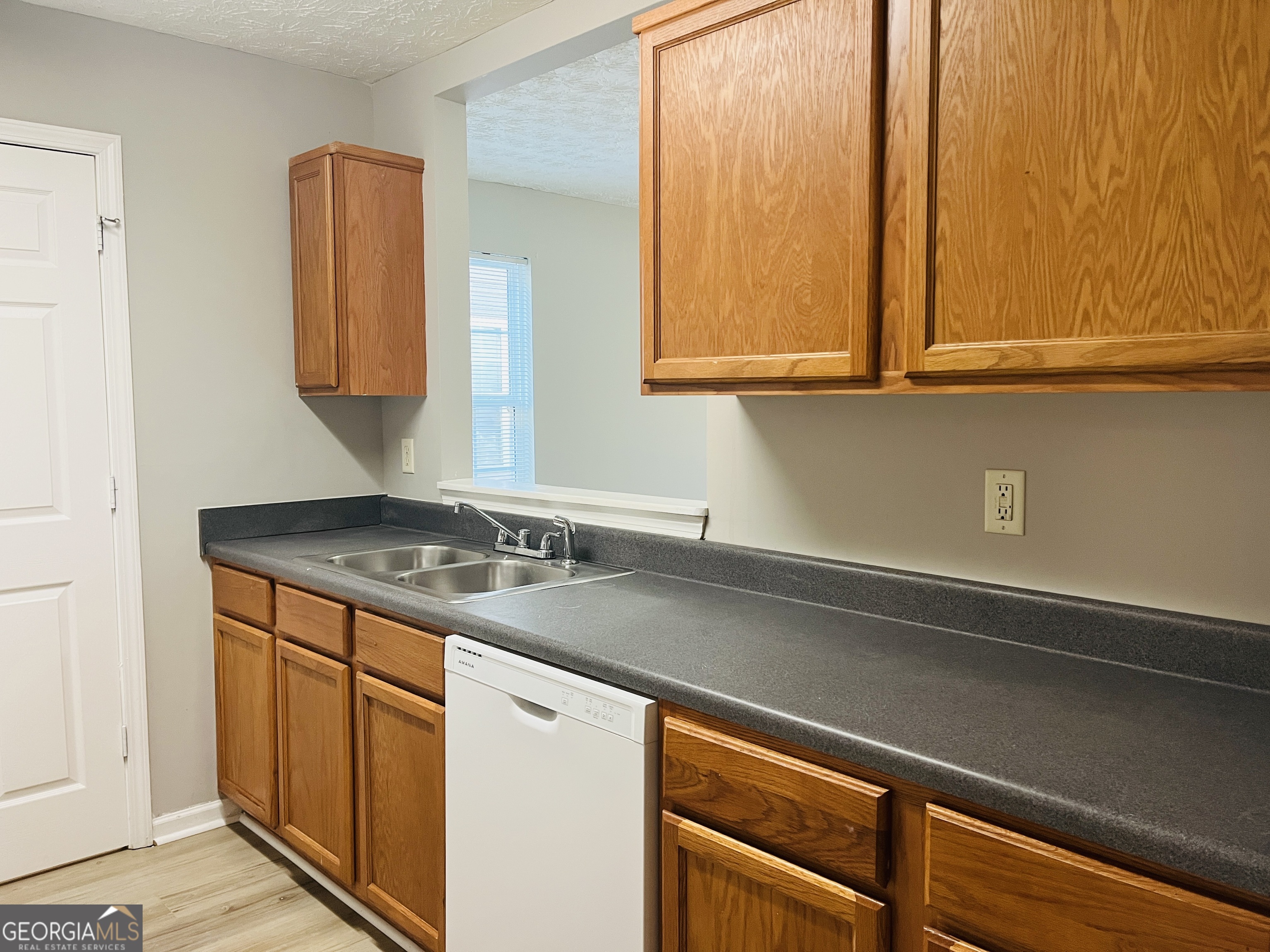 105 Granite Street, Unit B Hogansville, GA 30230 - Photo 10 of 28 a bathroom with a sink and a mirror