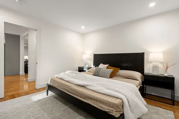a bedroom with a bed and a lamp