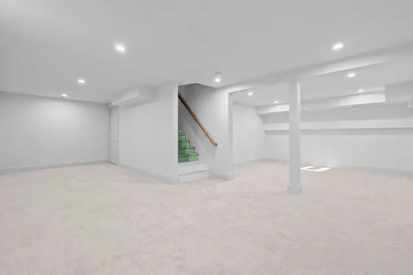 a view of an empty room with a ceiling fan