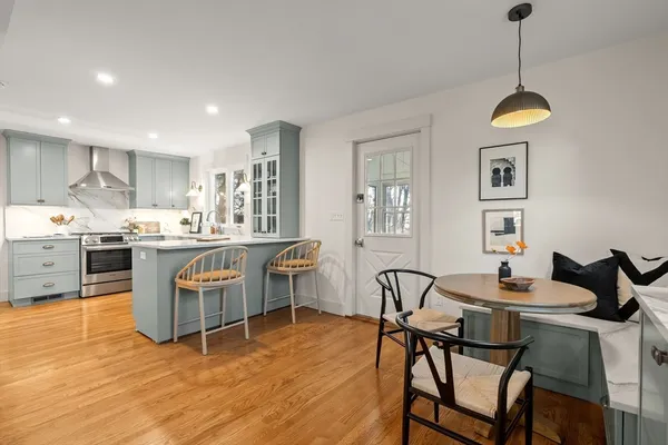 a dining room with furniture and window