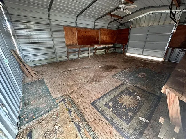 a view of a livingroom with furniture and staircase
