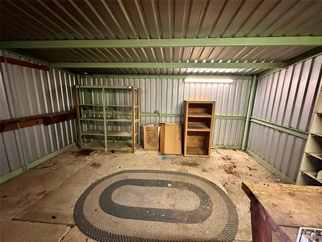a view of a porch with wooden floor