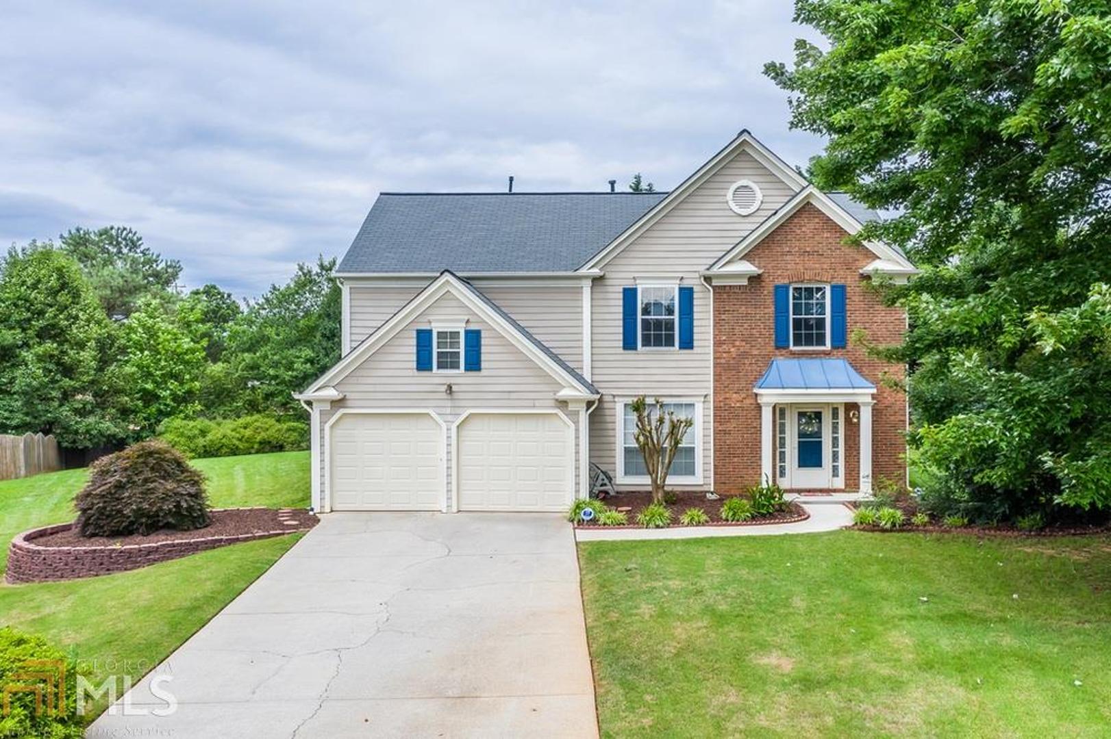 3685 Alcot Way Cumming, GA 30041 - Photo 1 of 1 a front view of a house with a yard