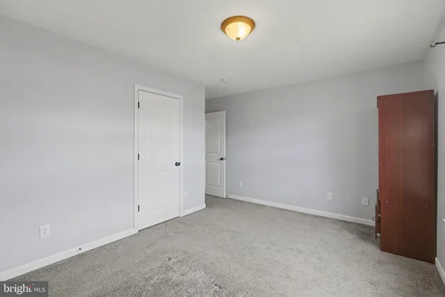 an empty room with a closet