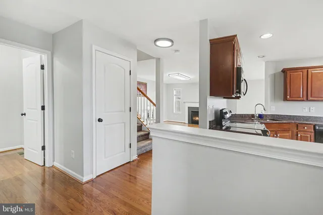 a kitchen with stainless steel appliances a sink and a refrigerator