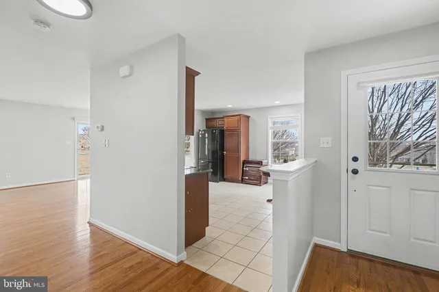 a view of a kitchen from the hallway