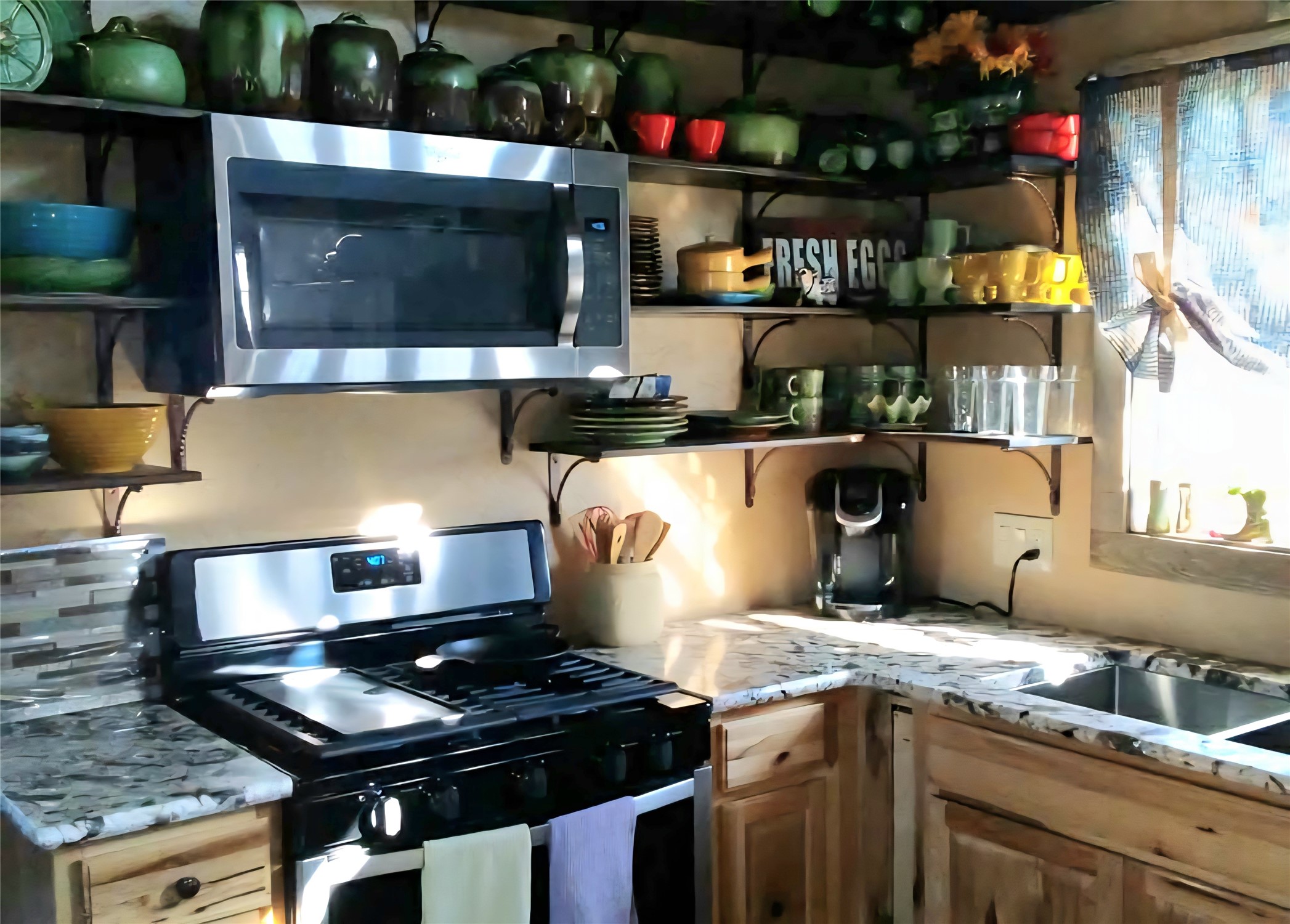 1332 Short Road Vanderpool, TX 78885 - Photo 32 of 44 a kitchen with a stove and a microwave