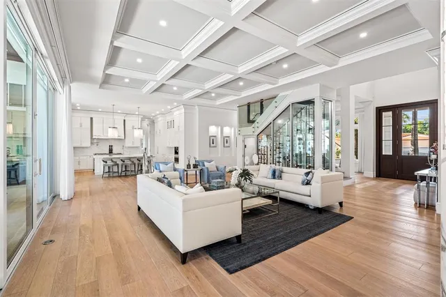 a living room with furniture pool table and a flat screen tv