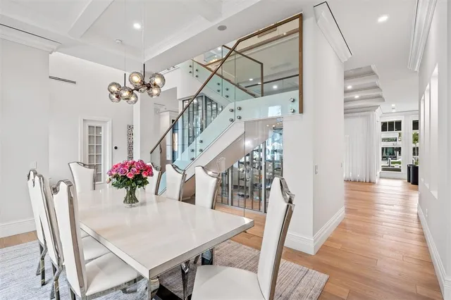 a living room with furniture flat screen tv and a large window