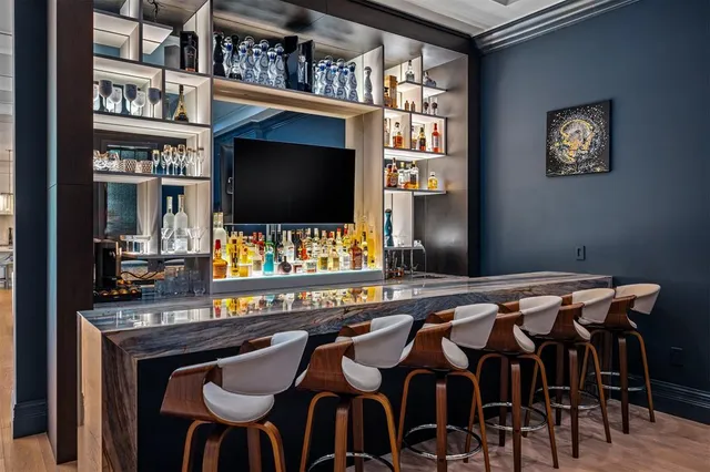 a view of a swimming pool with outdoor seating