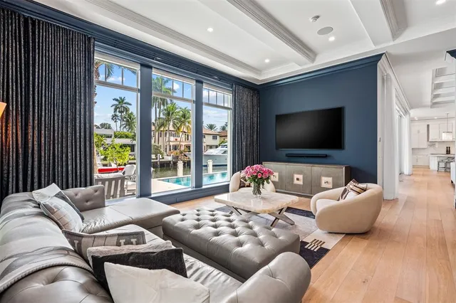 a white bath tub sitting next to a shower