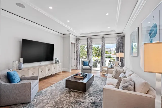 a bathroom with a toilet a sink a mirror a window and vanity