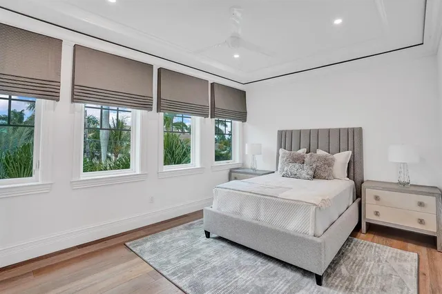 a front view of a house with yard and green space