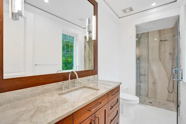 a view of an outdoor dining space with a table and chairs